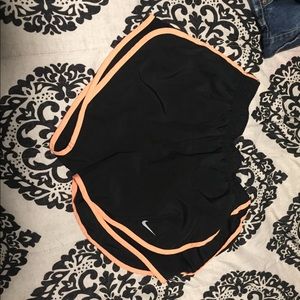 orange trimmed nike shorts